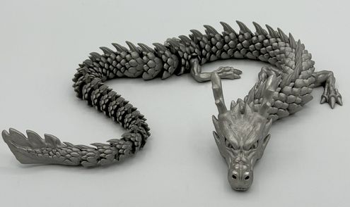  In Edelstahl gedruckter, beweglicher Drache – Endbearbeitung eines Metall-3D-Druckteils