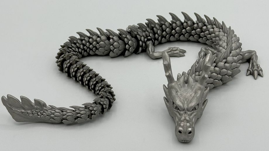  In Edelstahl gedruckter, beweglicher Drache – Endbearbeitung eines Metall-3D-Druckteils