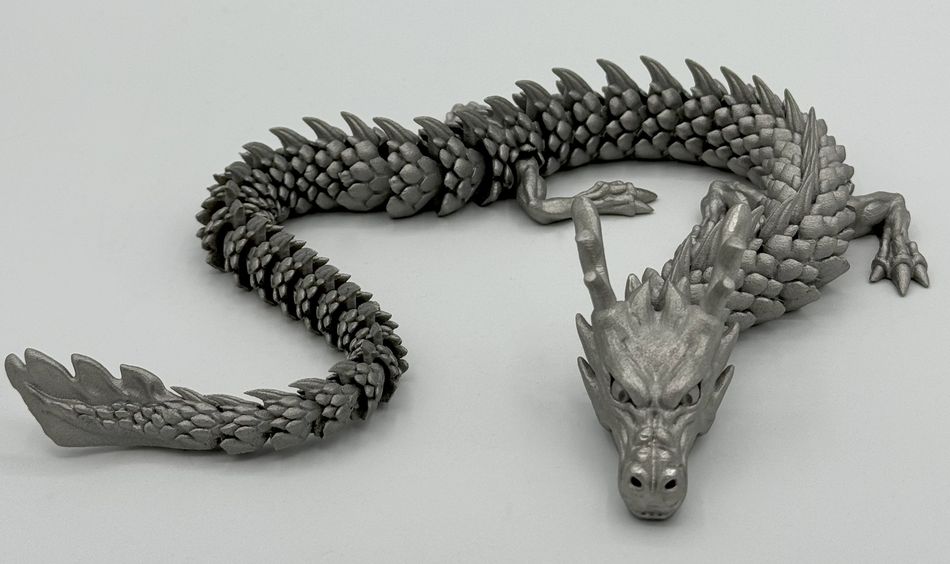  In Edelstahl gedruckter, beweglicher Drache – Endbearbeitung eines Metall-3D-Druckteils