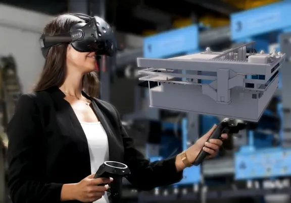 Schülerin mit VR-Brille bei der Gebäudeplanung